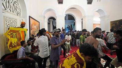 Protesters sing and dance after storming the Sri Lankan president's official residence. AP