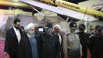 In this photo released by the official website of the office of the Iranian Presidency on August 22, Iran's President Hassan Rouhani unveils the surface-to-surface Fateh-313 in a ceremony marking Defense Industry Day. AP
