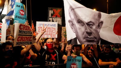 Israelis protest against Israeli Prime Minister Benjamin Netanyahu and his government's response to the financial fallout of the coronavirus disease (COVID-19) crisis outside Netanyahu's residence in Jerusalem. REUTERS