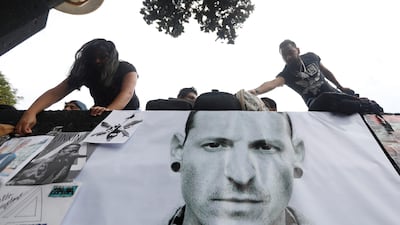 Fans stick posters as they gather at Revolucion monument to pay tribute to Chester Bennington, Linkin Park frontman, following the singer's death in Mexico City, Mexico. Edgard Garrido / Reuters