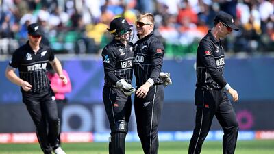 New Zealand's Glenn Phillips celebrates with teammates after taking the wicket of Australia's Steve Smith. AFP