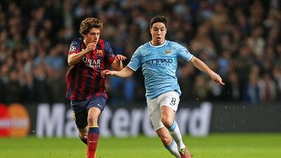Manchester City’s Samir Nasri, right, in action against Barcelona’s Sergi Roberto on Tuesday. Peter Byrne / PA