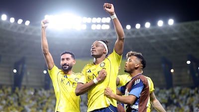 Mohamed Simakan, centre, celebrates scoring for Al Nassr. Getty Images
