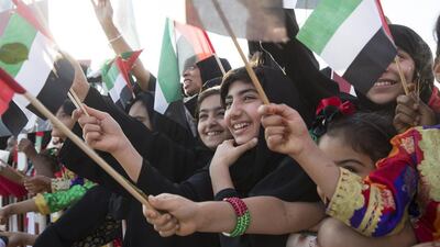 Emiratis welcome a convoy of UAE military vehicles and personnel as it travels from Al Hamra Military Base to Zayed Military City. Ryan Carter / Crown Prince Court — Abu Dhabi
