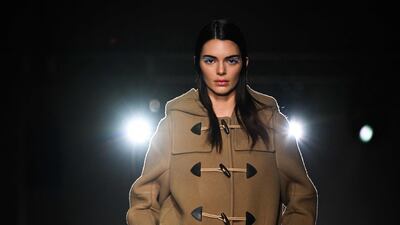 Model Kendall Jenner in a duffle coat at Prada. AFP