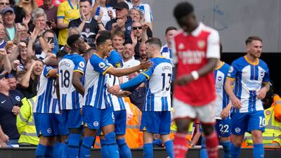 Brighton's Pervis Estupinan celebrates the third goal with teammates. AP