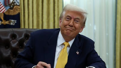 US President Donald Trump signing an executive order in the Oval Office at the White House. Reuters