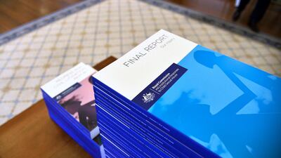 The 17-volume report from a five-year inquiry into child sexual abuse in Australia sits on a table at Government House in Canberra on December 15, 2017. Jeremy Piper / Australian Government Royal Commission via AP
