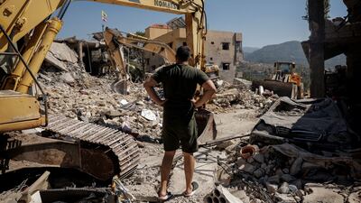 A man looks at destroyed houses amid an ongoing search for survivors after an Israeli strike in Maaysrah, north of Beirut, on September 26. Reuters