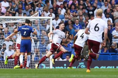 Burnley's Stephen Ward, centre, celebrates scoring against Chelsea at Stamford Bridge on 12 August 2017. Facundo Arrizabalaga / EPA