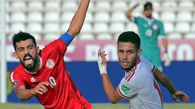UAE defender Alhasan Saleh under pressure from Mohamad Haidar of Lebanon. AFP