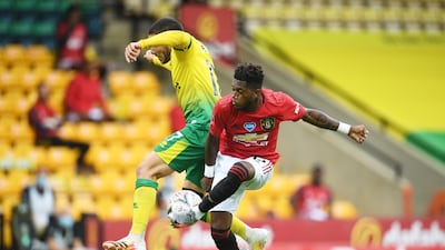 United's Fred battles for possession with Emiliano Buendia of Norwich. Reuters