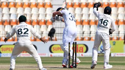 England's Matthew Potts gets bowled out by Sajid Khan. Reuters