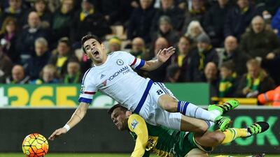Norwich City's English midfielder Jonathan Howson (bottom) slides in a challenge against Chelsea's Brazilian midfielder Oscar (top) during the English Premier League football match between Norwich City and Chelsea at Carrow Road in Norwich, eastern England, on March 1, 2016. RESTRICTED TO EDITORIAL USE. No use with unauthorized audio, video, data, fixture lists, club/league logos or 'live' services. Online in-match use limited to 75 images, no video emulation. No use in betting, games or single club/league/player publications. / AFP / BEN STANSALL / RESTRICTED TO EDITORIAL USE. No use with unauthorized audio, video, data, fixture lists, club/league logos or 'live' services. Online in-match use limited to 75 images, no video emulation. No use in betting, games or single club/league/player publications.