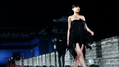 A Pierre Cardin fashion show takes place on the ancient city walls of Beijing, China, in March 2007. AFP