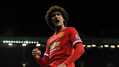Manchester United's Marouane Fellaini celebrates scoring the opening goal during the club's 2-1 win over Stoke City on Tuesday in the Premier League. Peter Powell / EPA / December 2, 2014