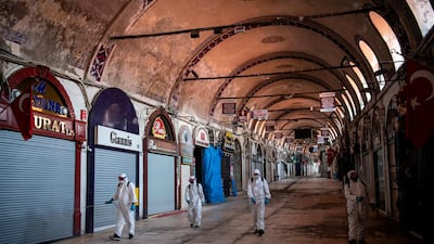 Municipal workers disinfect the historic Grand Bazaar in Istanbul, Turkey. AFP