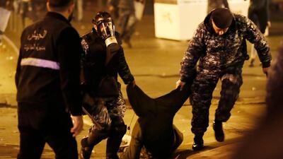 Riot police officers arrest an anti-government protester trying to enter a central square in downtown Beirut. AP Photo
