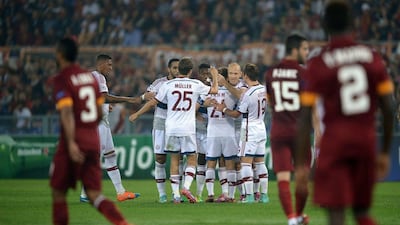 Bayern Munich's Arjen Robben celebrates with teammates after scoring one of the side's seven goals in a 7-1 win over AS Roma in the Champions League on Tuesday night in Rome. Filippo Monteforte / AFP / October 21, 2014