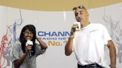Anisha Senaratne, 17, shares a lighter moment with DJ Moe during the Radio Star 2009 talent search at the Arabian Centre Mall.