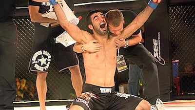 Ali Mohammed Ali Abdullah Ahli celebrates after winning his fight against Luciano Ferreira last night.