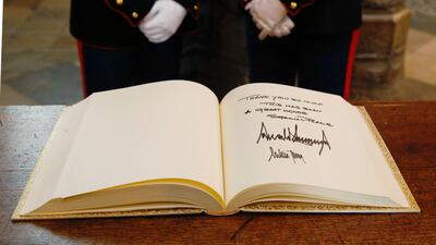 The Distinguished Visitors' Book, signed by US President Donald Trump and US First Lady Melania Trump, sits on a table at Westminster Abbey in London, UK. Bloomberg