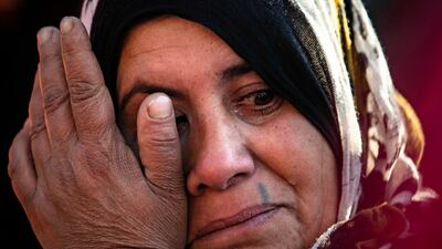A woman mourns at a funeral for two Syrian Democratic Forces (SDF) fighters in the Syrian Kurdish-majority city of Qamishli, after they were killed by a Turkish military drone, according to Kurdish security officials. AFP