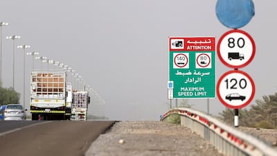Conflicting speed limits are displayed on Sheikh Zayed Road in the direction of Abu Dhabi on Sunday. One advertising the 120kph speed limit with the old 20kph buffer, and a second informing drivers that cameras flash drivers at 140kph. A third sign - which was installed recently - remains wrapped in blue plastic, which suggests there may be further planned changes. Chris Whiteoak / The National