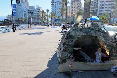 Displaced Lebanese fleeing Israeli air strikes in Beirut's southern suburbs sit along the corniche in Al Manara neighbourhood of Beirut on March 8. EPA