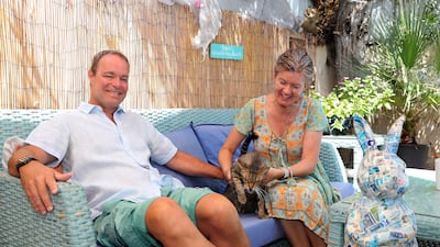 The couple with one of their pet cats at their villa in Jumeirah 3 in Dubai
