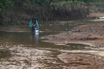 Getting water for the family is a burden often shouldered by girls and women. AFP