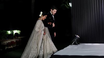 Newlyweds Priyanka Chopra, 36, and Nick Jonas, 26, pose for a photograph during a reception at a hotel in New Delhi on December 4, 2018. Photo: EPA