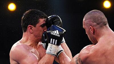 Huck, left, had no problems and won in the 10th round of the bout by knock-out.