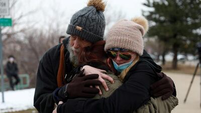 Sarah Moonshadow is comforted by David and Maggie Prowell after Moonshadow was inside King Soopers grocery store during the shooting. Reuters