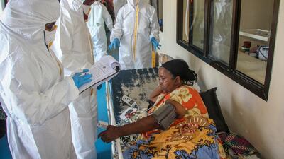 Doctors tend to a patient suffering from Covid-19 and receiving oxygen, in a ward for coronavirus patients at the Martini hospital in Mogadishu, Somalia. AP Photo
