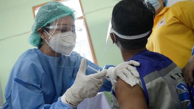 A health worker receives a dose of Covishield Covid-19 vaccine at Yangon General Hospital, in Yangon, Myanmar. EPA