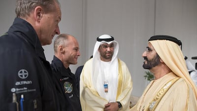 Sheikh Mohammed bin Rashid, Vice President and Ruler of Dubai, right, greets Bertrand Piccard, second left, the founder and chairman of Solar Impulse, while Solar Impulse chief executive André Borschberg, left, and Sultan Al Jaber, the chairman of Masdar look on. Mohamed Al Hammadi / Crown Prince Court - Abu Dhabi