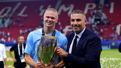 Manchester City chairman Khaldoon Al Mubarak and Erling Haaland with the Super Cup trophy. PA
