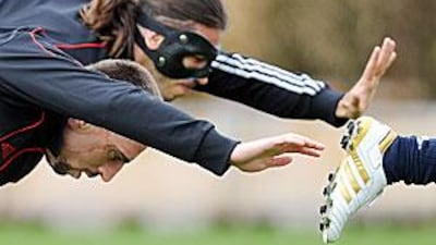 Bayern Munich's French midfielder Franck Ribery, front, and their Argentine Martin Demichelis train ahead of tonight's Champions League quarter-final first leg against Manchester United in Germany.