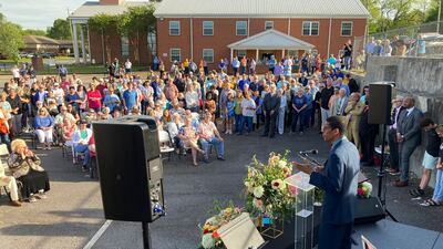 A pastor speaks at a prayer vigil outside First Baptist Church. AP Photo