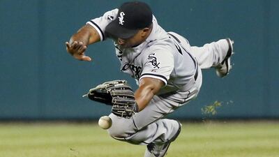 Right fielder Dayan Viciedo #24 of the Chicago White Sox can’t make a diving catch on a fly ball hit by Torii Hunter of the Detroit Tigers in the eighth inning at Comerica Park in Detroit, Michigan. Duane Burleson / Getty