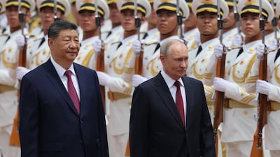 The leaders inspect an honour guard. EPA