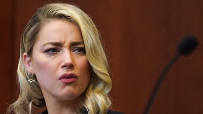 Heard watches former friend Pennington testify. EPA