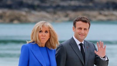 Brigitte, wearing a cobalt blue shift dress with a matching coat, visits Cornwall on June 11, 2021. AFP