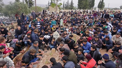 Mourners attend the funeral of Raed Fares and Hammud Al Junayd in the village of Kafranbel in the north-western province of Idlib. AFP