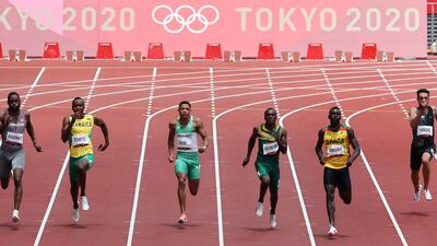 Lebanon's Noureddine Hadid , far right, competes in the men's 200m heats.