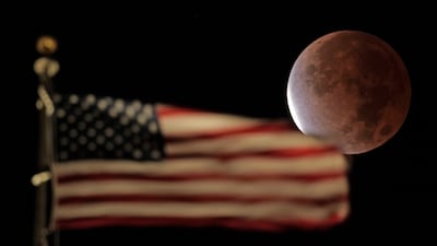 The Earth's shadow covers the full moon during a partial lunar eclipse on Friday, November 19, 2021, in Kansas City, Missouri. AP Photo