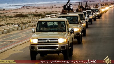 An image made available by the propagandist militant media outlet Welayat Tarablos on February 18, 2015, allegedly shows ISIL militants parading through Sirte. Welayat Tarablos/AFP Photo