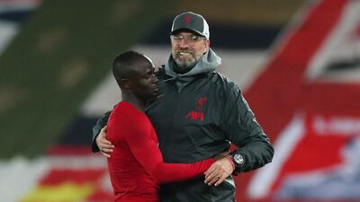 Jurgen Klopp celebrates with Sadio Mane after the match. Reuters