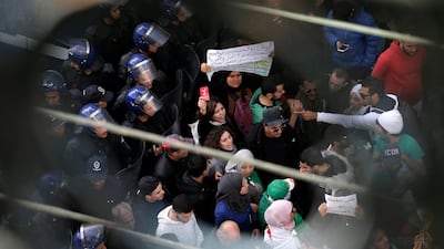 Algerian students are circled by a group a police officers during a protest in Algiers. AP Photo